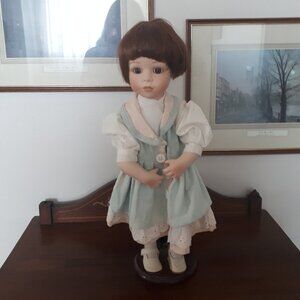 Doll with stand.